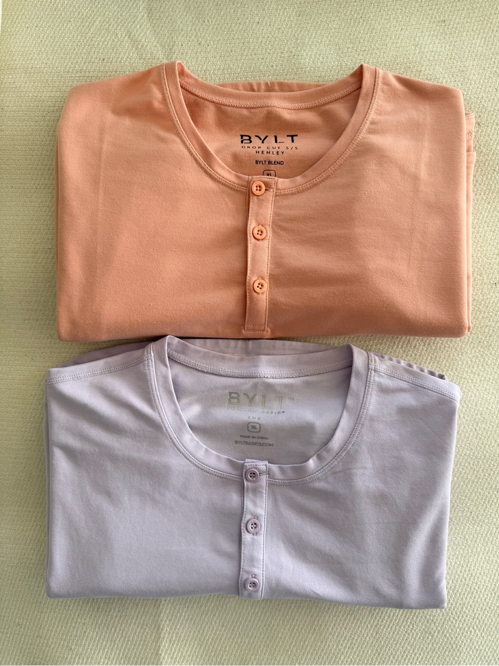 BYLT Basics Men’s Drop Cut Henley-Set of 2 in Light Purple and Peach Color